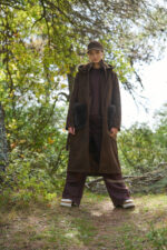 Wool coat with 2 pockets, fur trim, and belt.